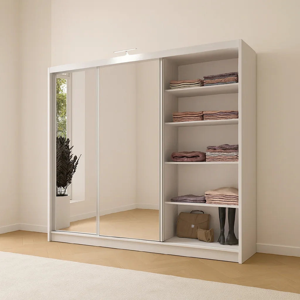 White sliding door wardrobe with mirror doors in a bedroom